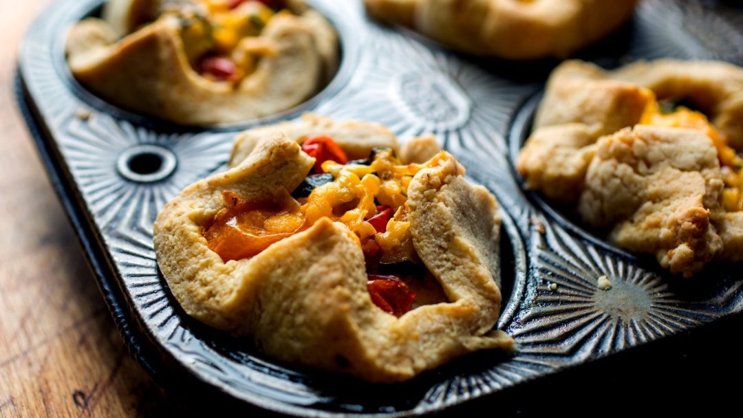 Zucchini and Tomato Tartlets With a Cheddar Crust