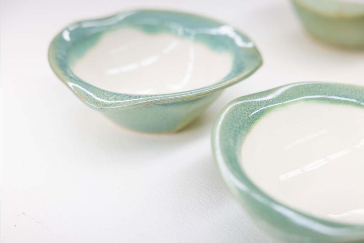 Ceramic bowls with aqua trimming.