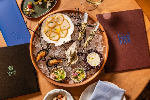 A seafood spread from Casa Juani includes razor clams, mussels, sea urchin and other marisquería selections served over ice. Casa Juani opens Thursday at 901 Pearl St. in Boulder. (Casey Wilson/Courtesy photo)