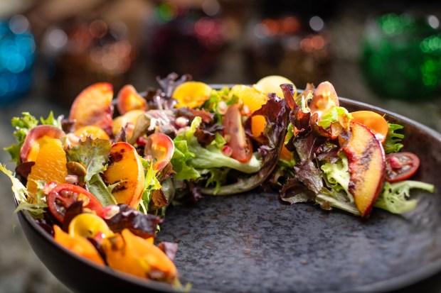 The Jiko Salad (Lolla Rosa lettuce, seasonal apples, pickled shallots with Baobab Vinaigrette. (Photo courtesy ©2026 Disney. All rights reserved.)