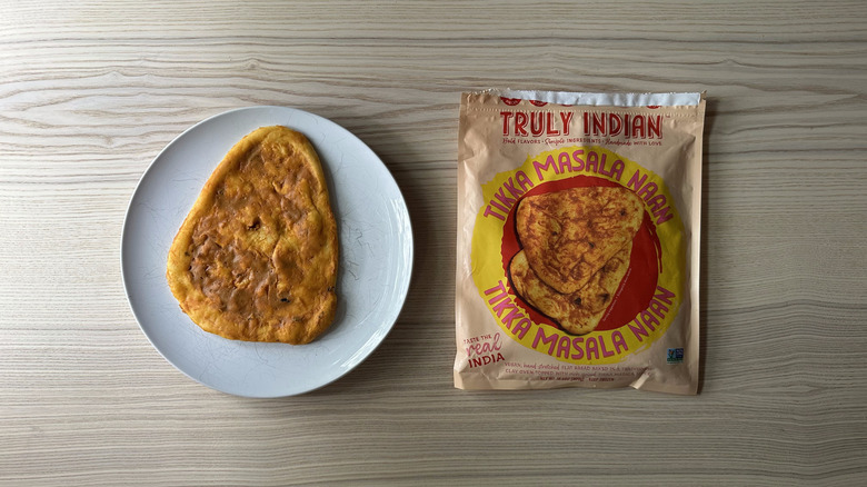 Truly Indian Tikka Masala Naan on white plate