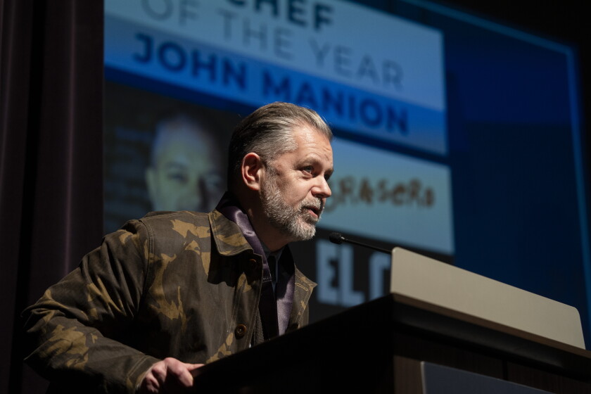 Chef John Manion stands at a podium during last year's Banchet Awards