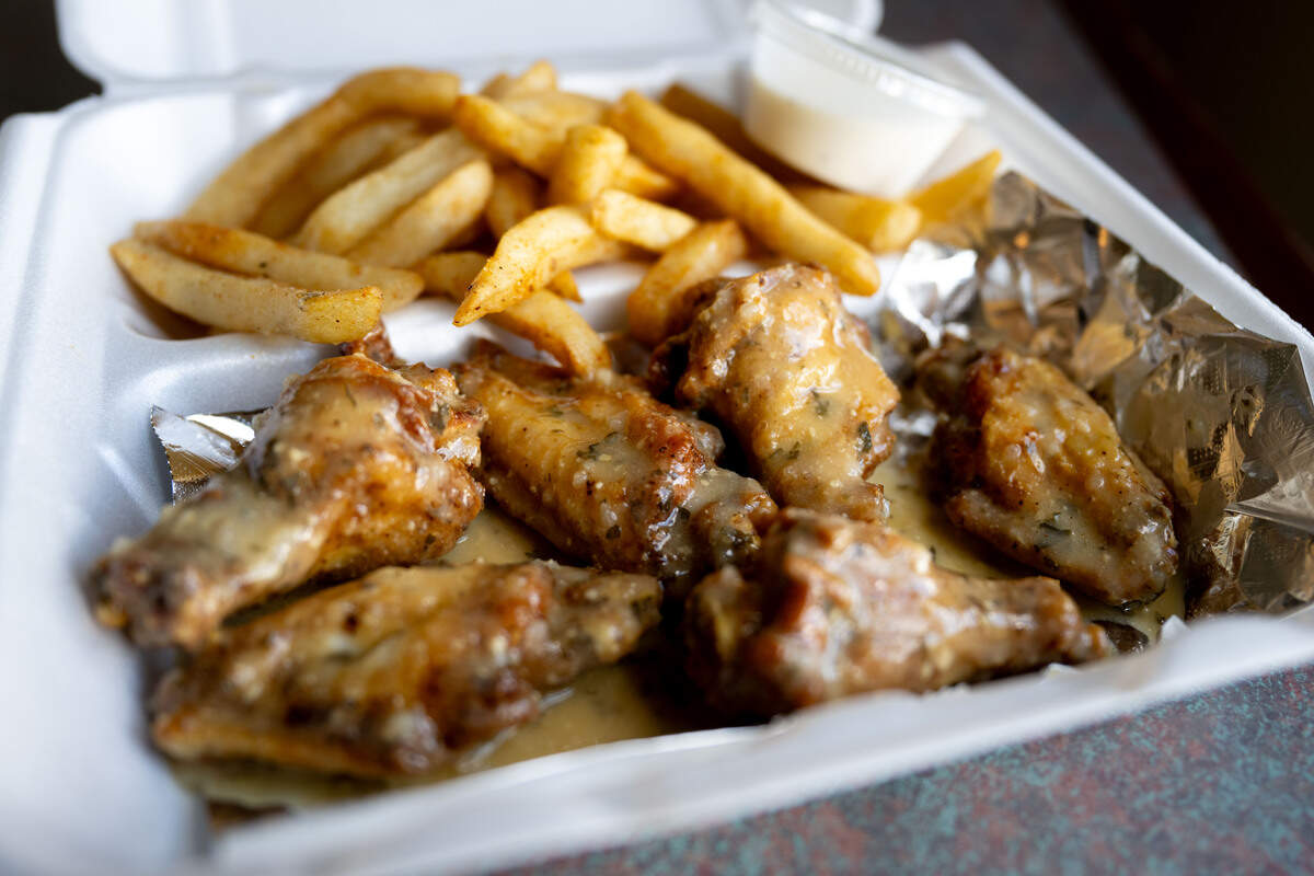 Garlic parmesan wings and french fries from OTF Wings at the Gulfport Premium Outlets on Wednesday, Sept. 2, 2026.