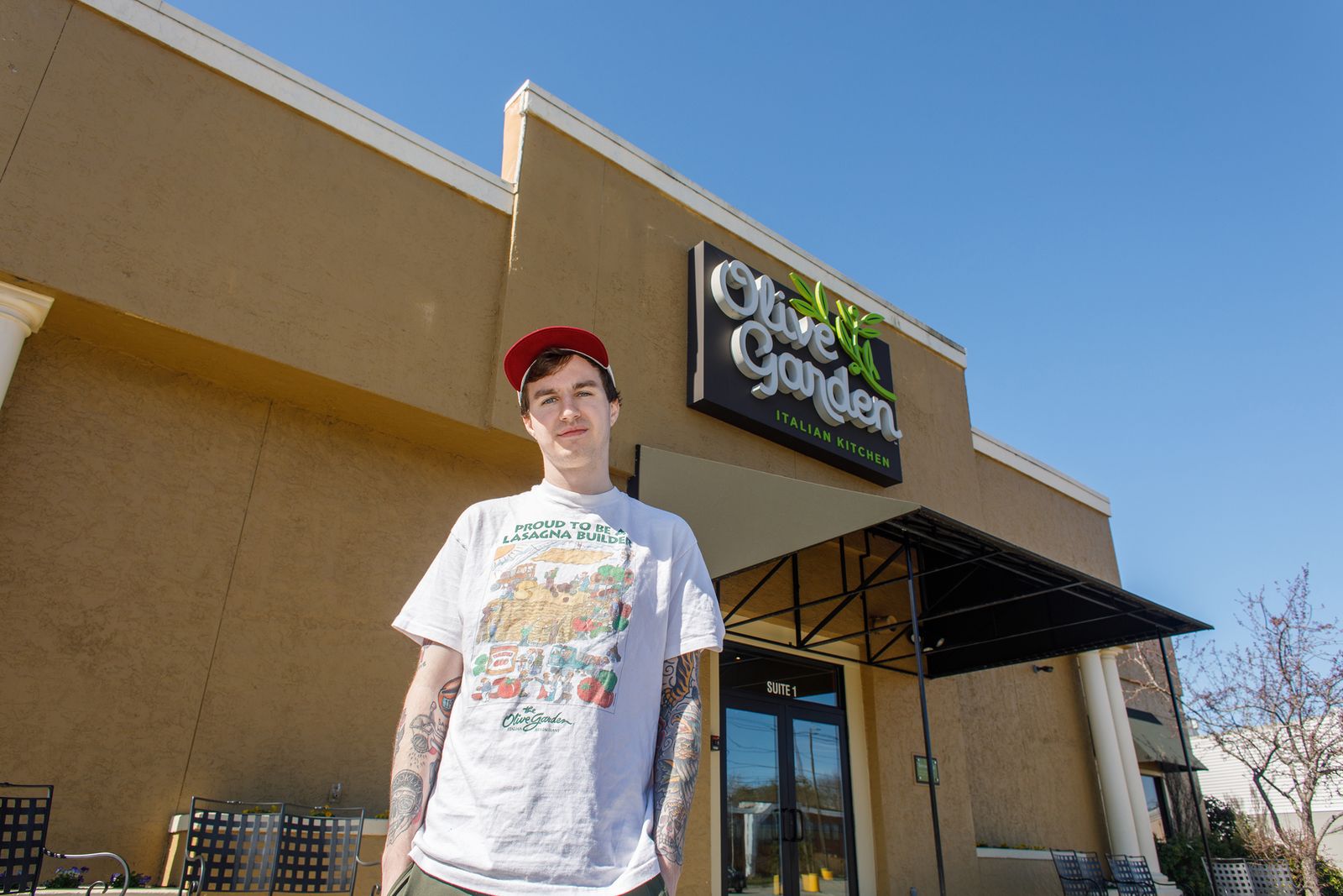 Braden Sinclair in front of an Olive Garden restaurant.