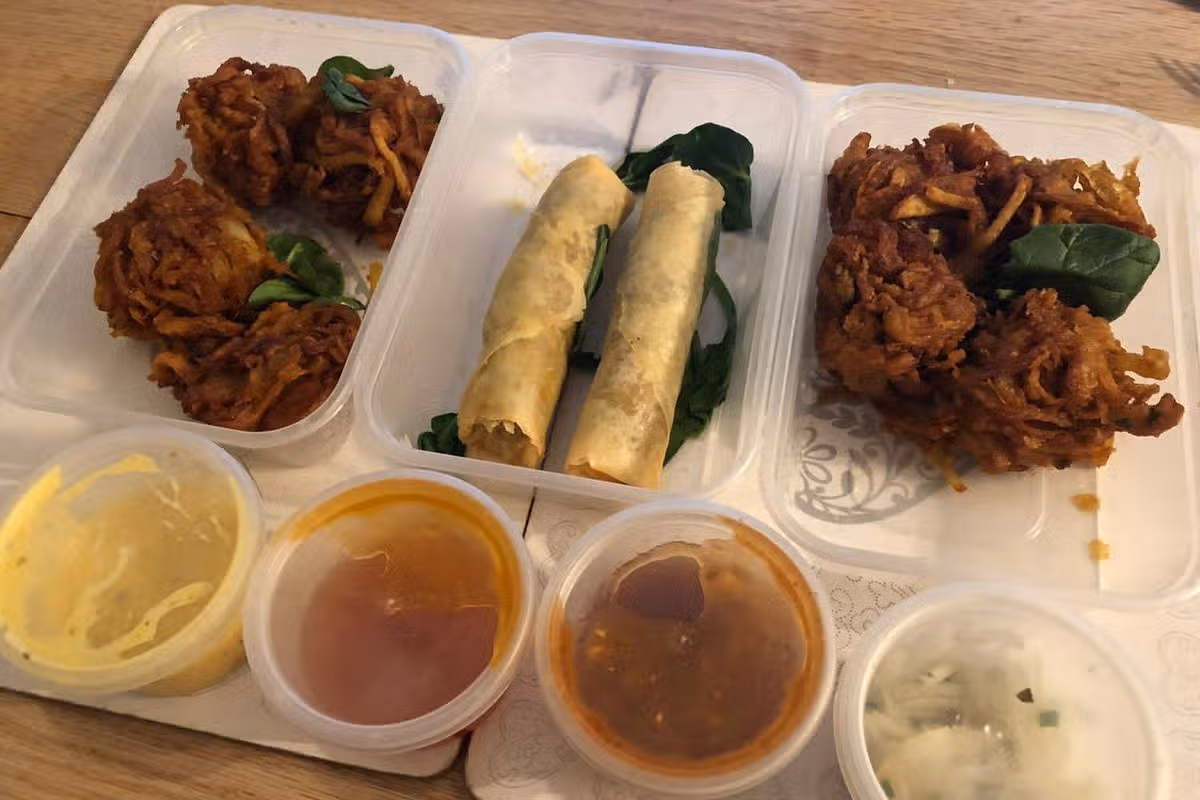 Indian takeaway from Holdi restaurant in Woolton Village. Onion bhajis and lamb and peas samosas