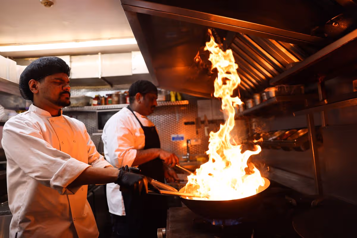 Chefs at work in the kitchen in Ikkayees on South Hunter Street in Liverpool
