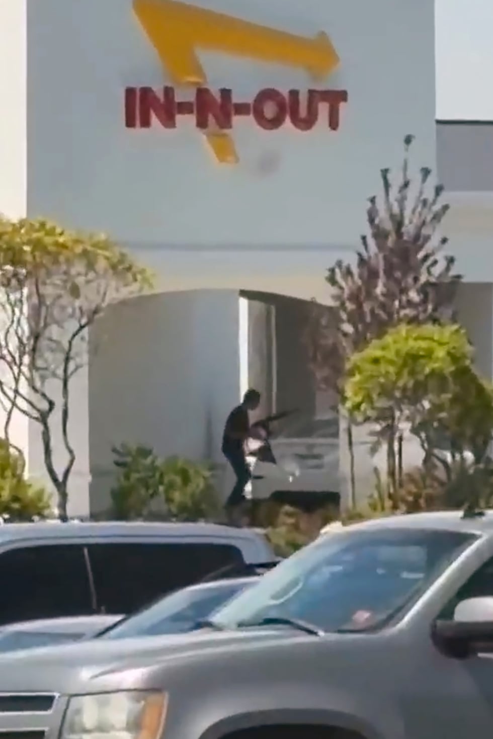 This still image captured from video by a witness shows the scene of a shooting that started...