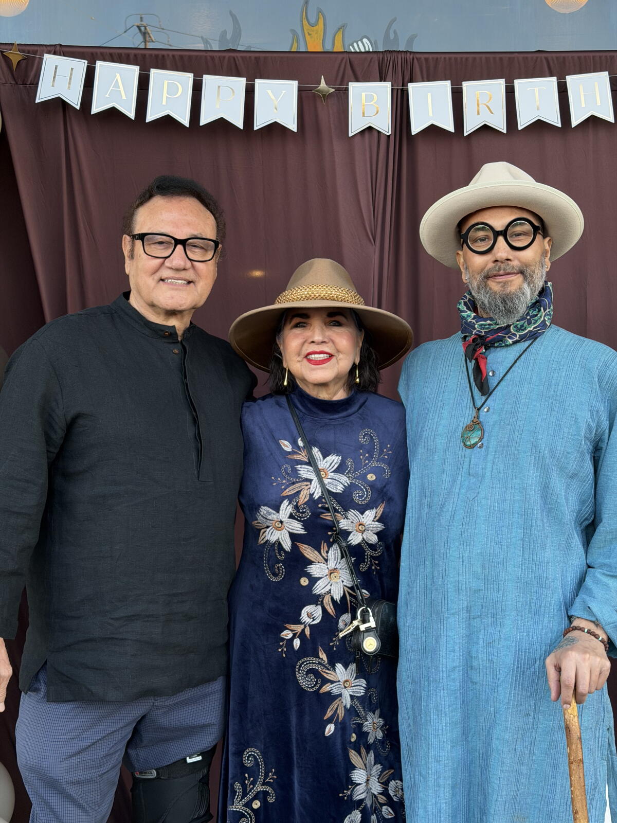 Joshua Gil, right, with his parents Gabriel and Nellie in January.