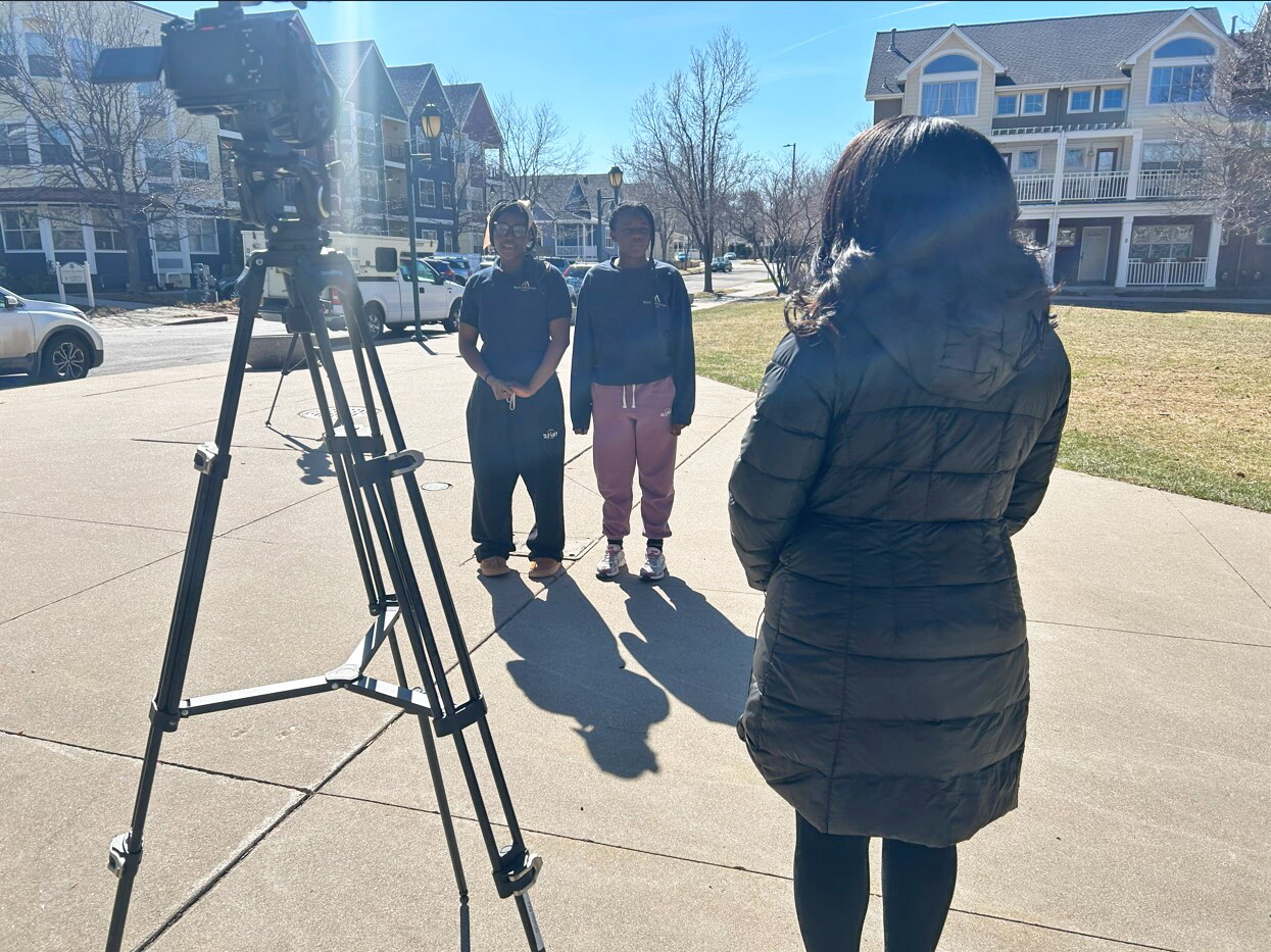 14-year-old Maliyah Thomas and 13-year-old Dallas Taylor talk with Micah Smith