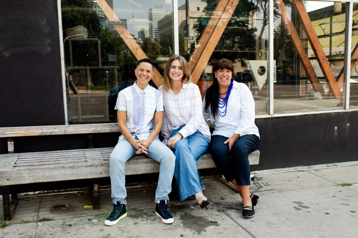 Denver Restaurant Owner Supports the Swipe Fee Relief Act three people posing in front of a building