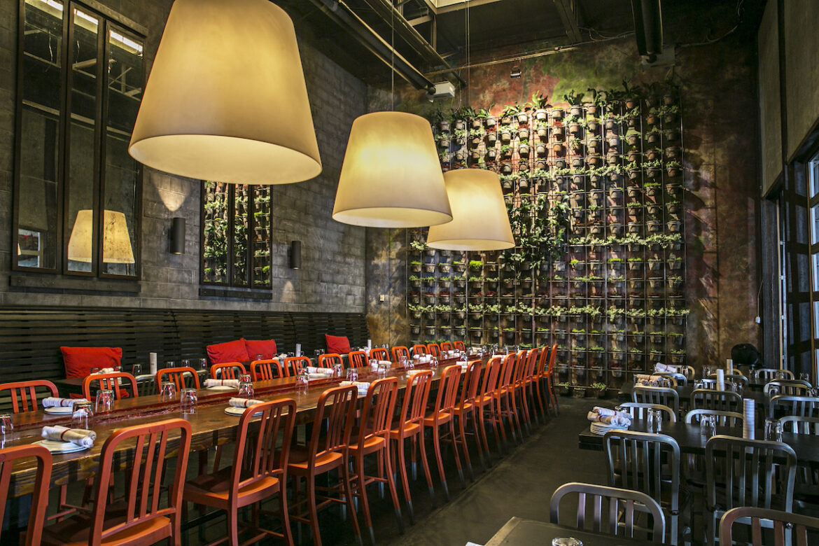 Where to Host a Holiday Party in Atlanta: 13 Restaurants With Private Dining Rooms A dramatic plant wall and communal tables set the scene for group gatherings at Two Urban Licks.