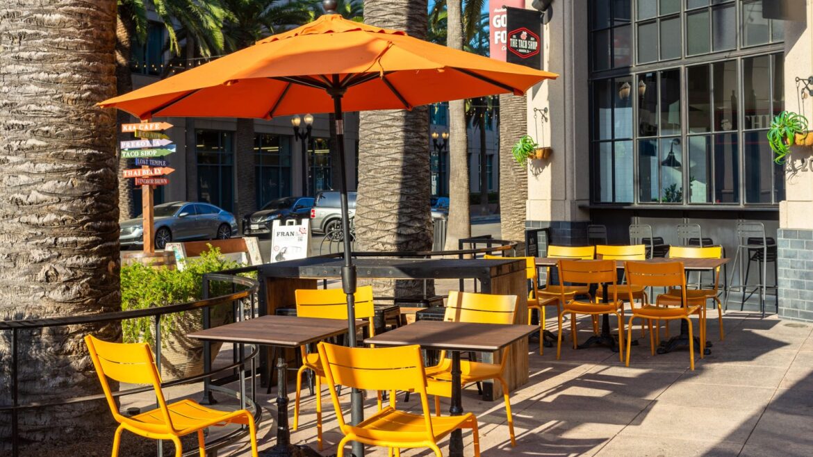 South Carolina Woman Was Struck & Killed By Patio Umbrella An outdoor food court patio outside a restaurant with tables and umbrellas
