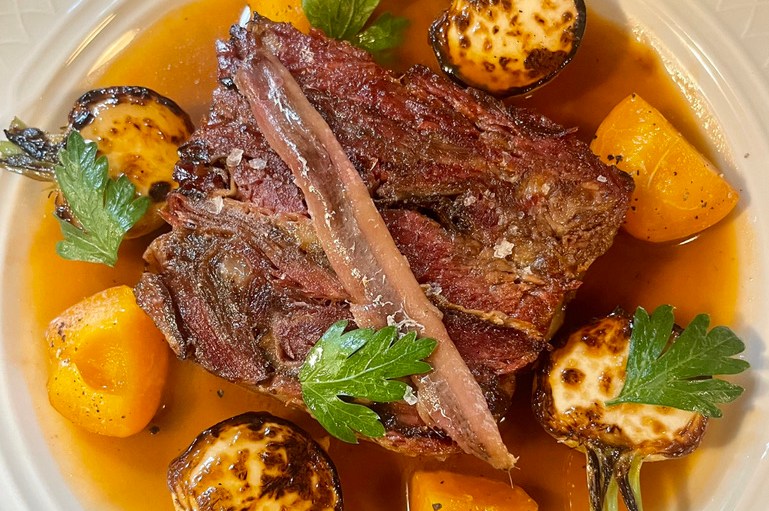 A meaty main with roasted spring onions and anchovy.
