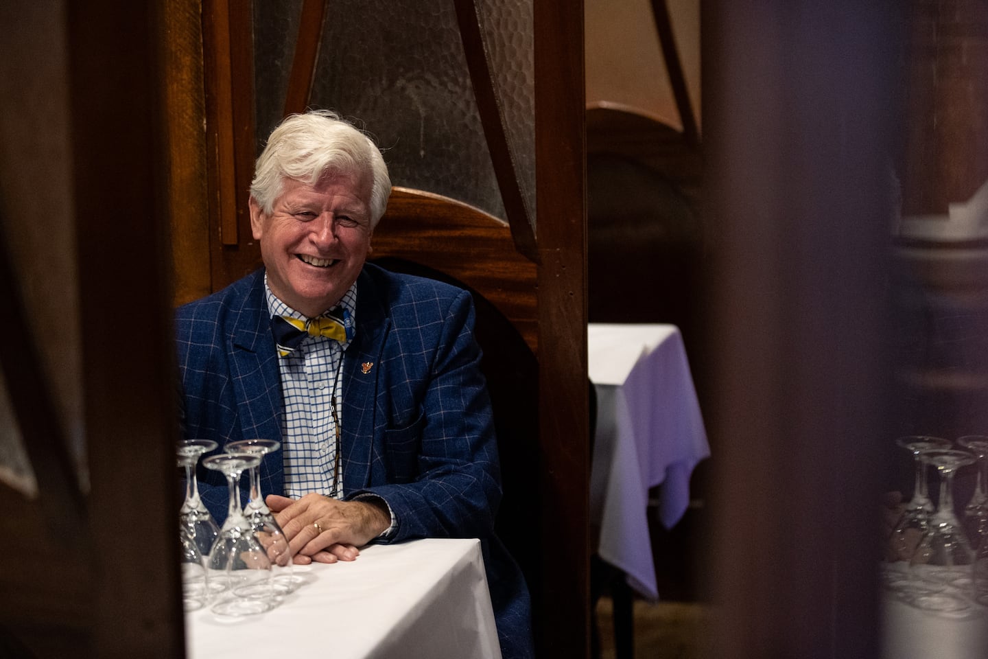 Bob Burke, the owner of Pot Au Feu, poses for a photo in the dining room of his bistro in Providence, Rhode Island.