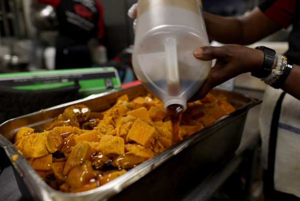 Cooper's Restaurant and Lounge's candied yams are made from scratch daily. As seen Wednesday, June 17, 2026. (Stephen M. Katz / The Virginian-Pilot)