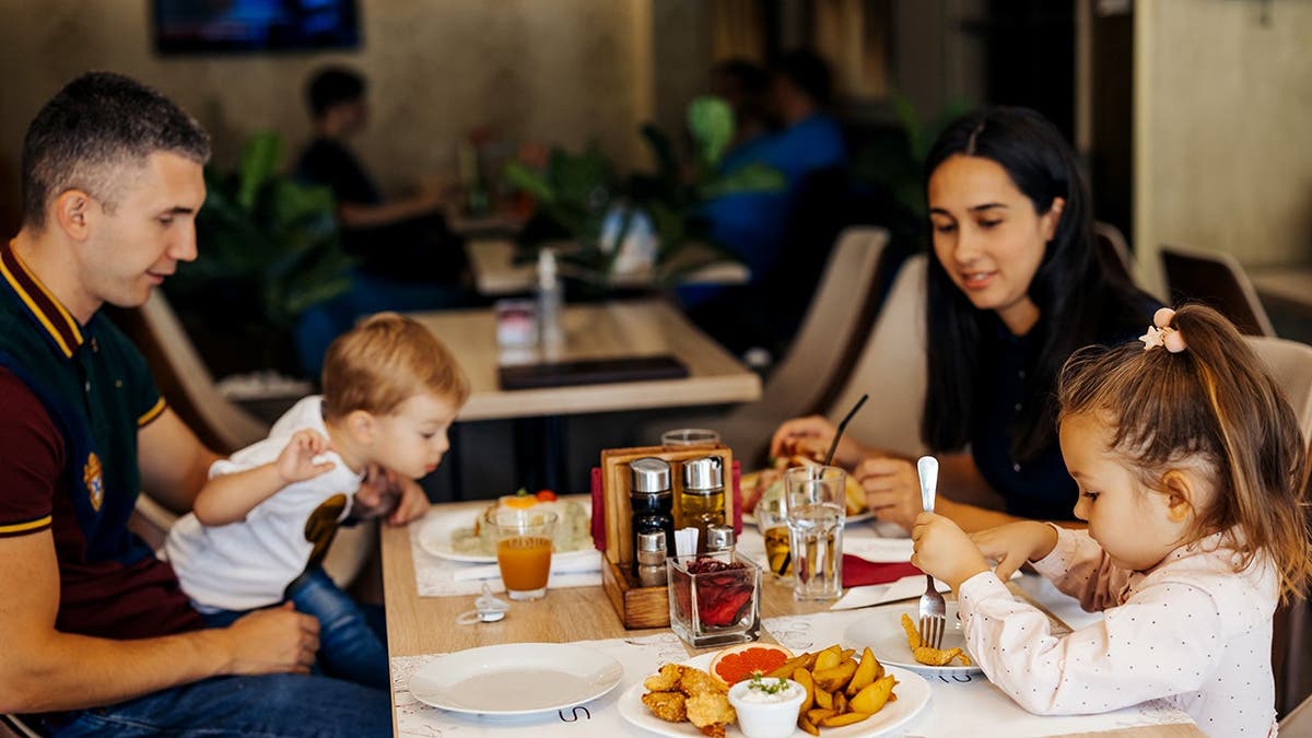 A family eats together at a restaurant.