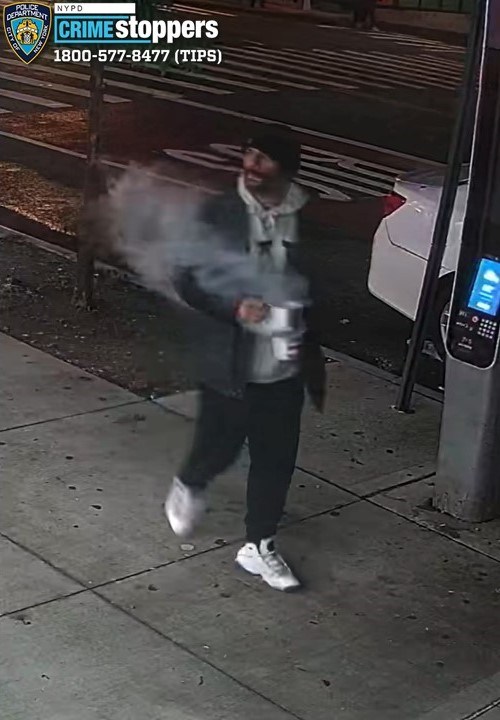 A stranger carrying what appears to be a thermos with steaming liquid randomly tossed the burning brew at a man in East Harlem Monday night, cops said.