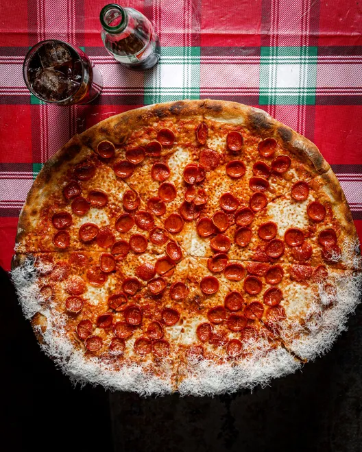 Amelia Street Pizza Co. pizza has a shaved pecorino sprinkle on half of its crust.