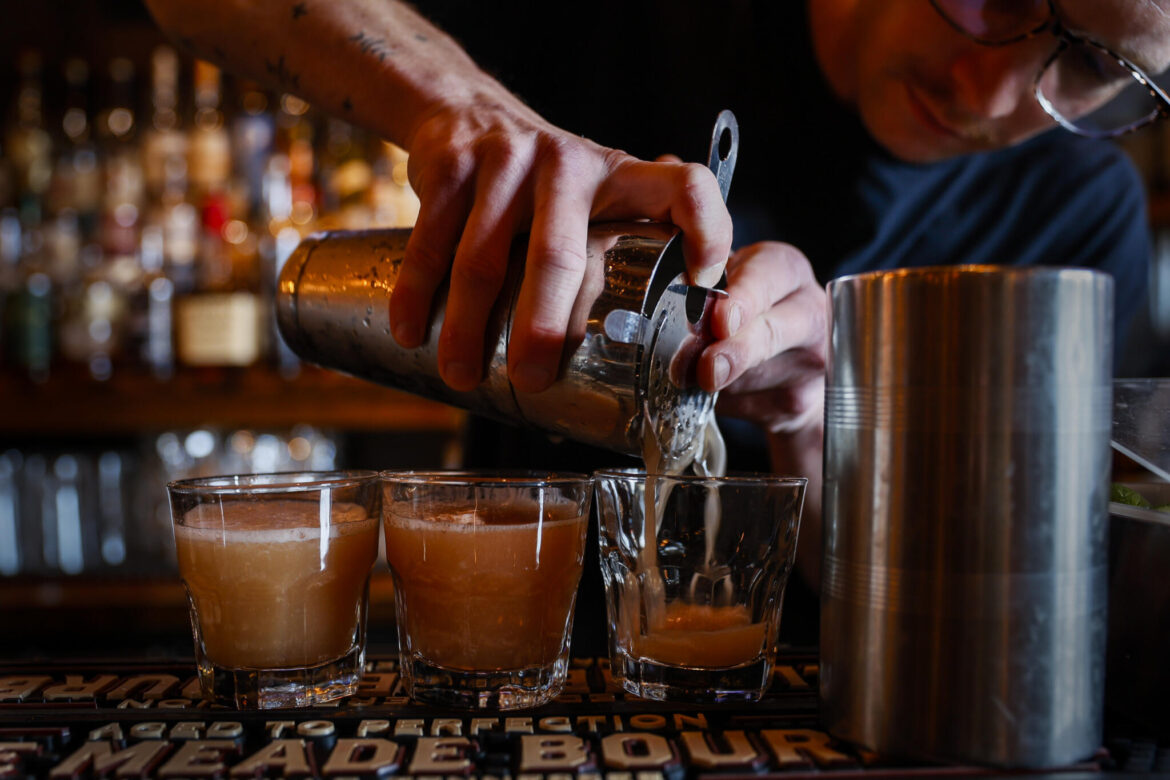 Mass. auditor report calls for repealing state’s local liquor licenses caps A bartender pours a drink at The Quiet Few in East Boston.