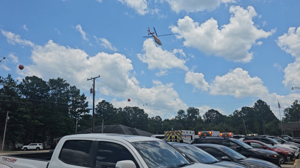 Fourth victim dies a day after mass shooting at Arkansas grocery store, police say A helicopter flies as emergency vehicles are seen near the scene of a shooting incident in Fordyce