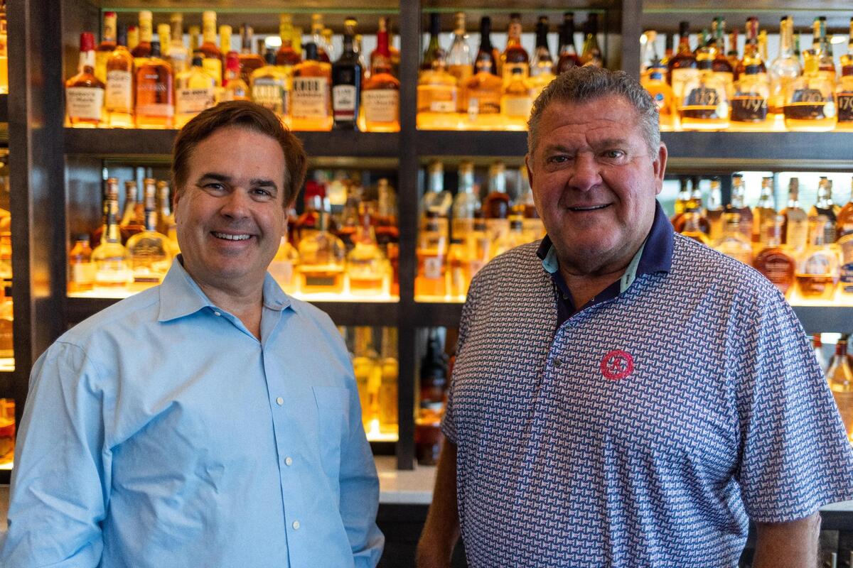Malone’s steakhouse co-founders Brian McCarty, left, and Bruce Drake, right, in 2023 celebrating the 25th anniversary of the first restaurant location at the Lansdowne shopping center, as well as the forming of Bluegrass Hospitality Group which owns other restaurants such as Drake’s and Harry’s.