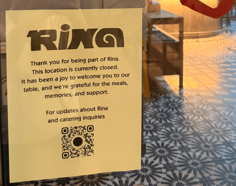 Signage indicating Rina's closure appeared in the restaurant's window over the weekend. Photo by Logan C. Ritchie. 