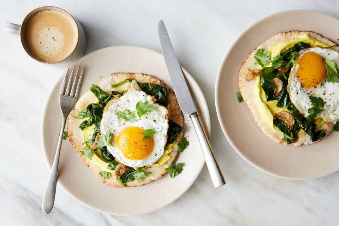 Indian-Spiced Eggs With Spinach and Turmeric Yogurt