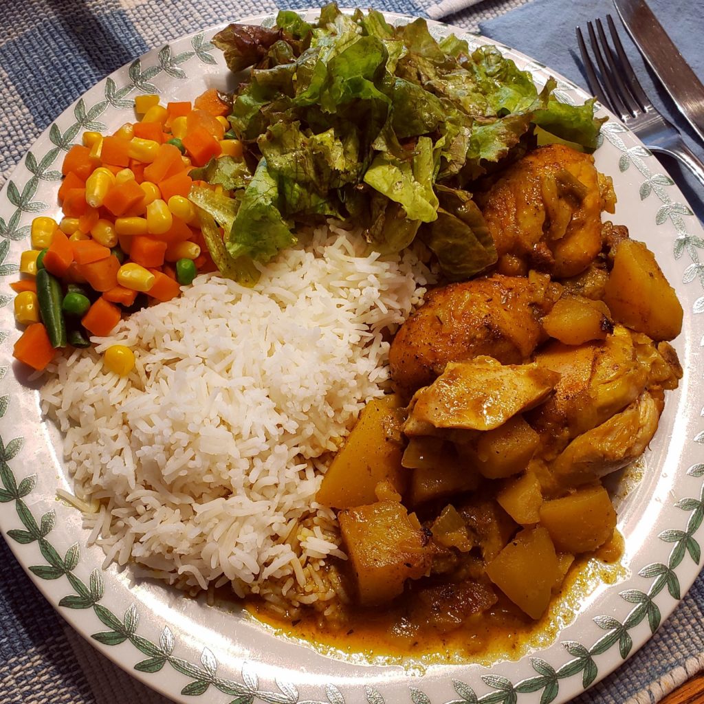 Jamaican chicken curry with basmati rice, mixed veggies, and fresh lettuce from the garden