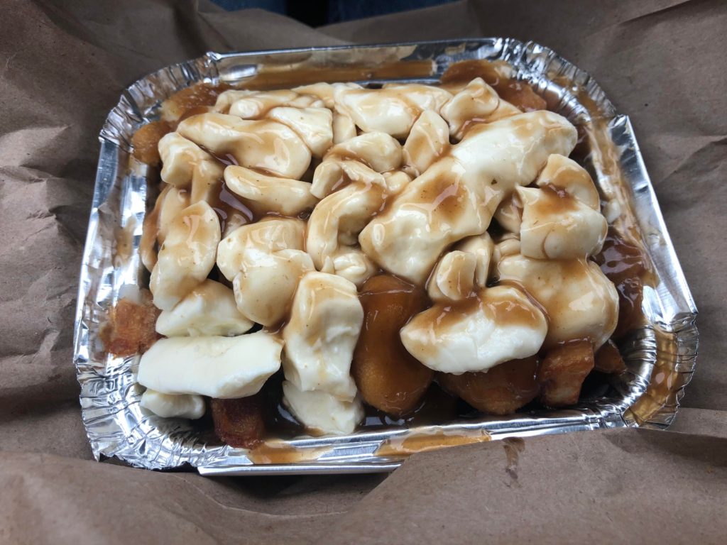 Poutine from Québec, they added fried cheese curds to regular cheese curds and fries.