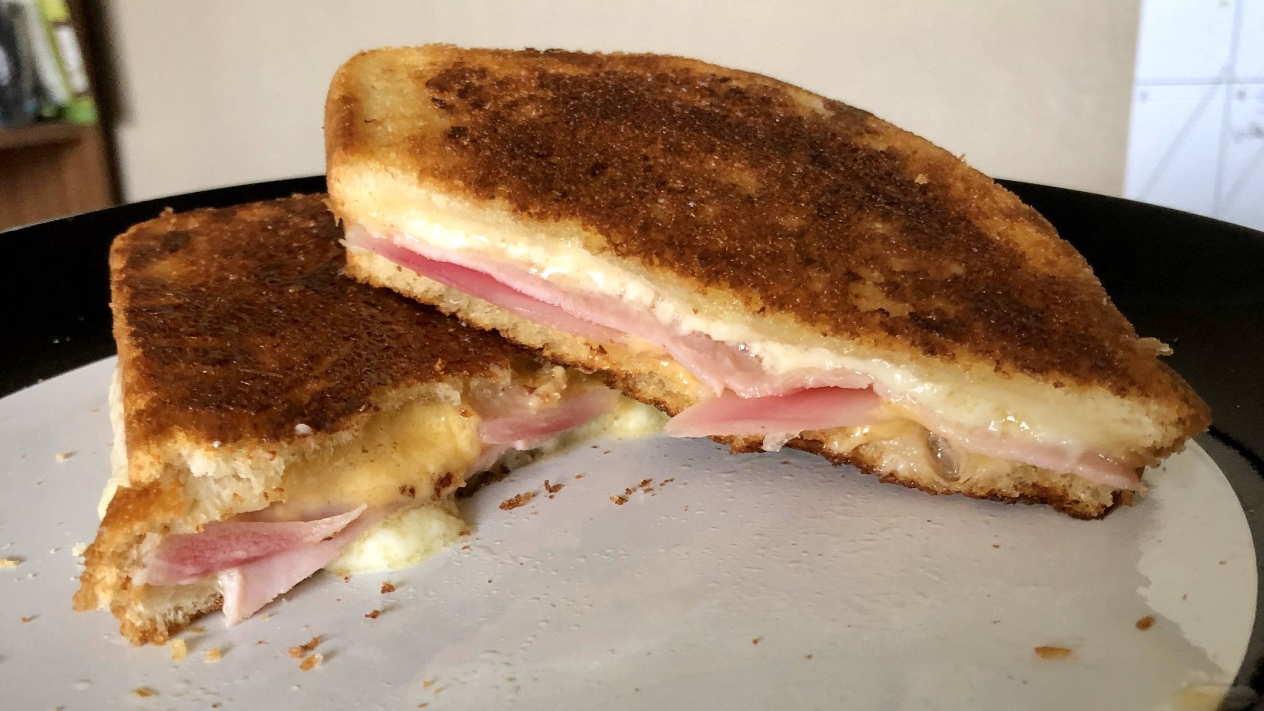 Havarti, sharp cheddar cheese, ham and homemade pickled red onion on extra sourdough bread