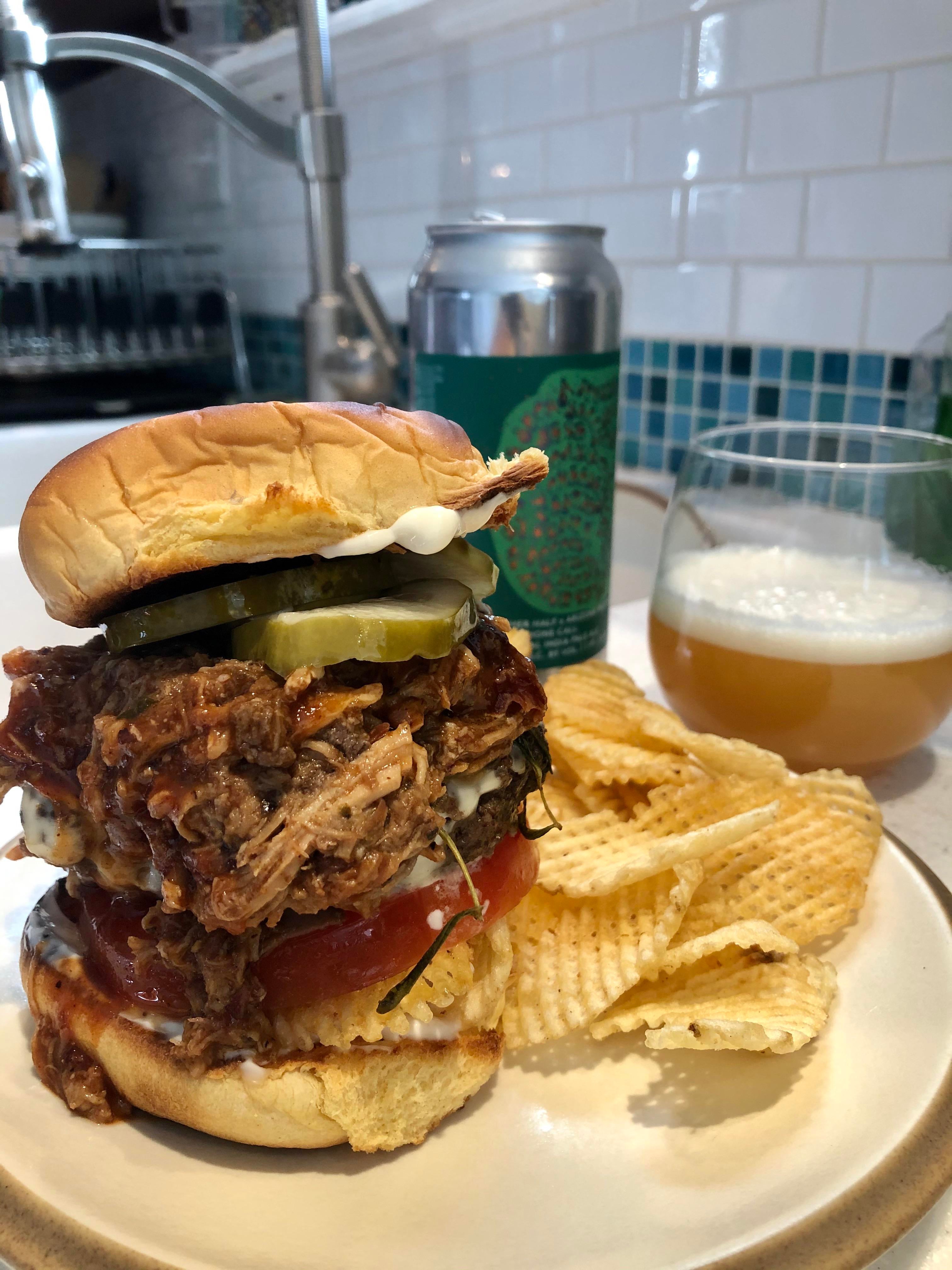 Stubbs BBQ pulled pork cheese burger with homemade pickles Dining and