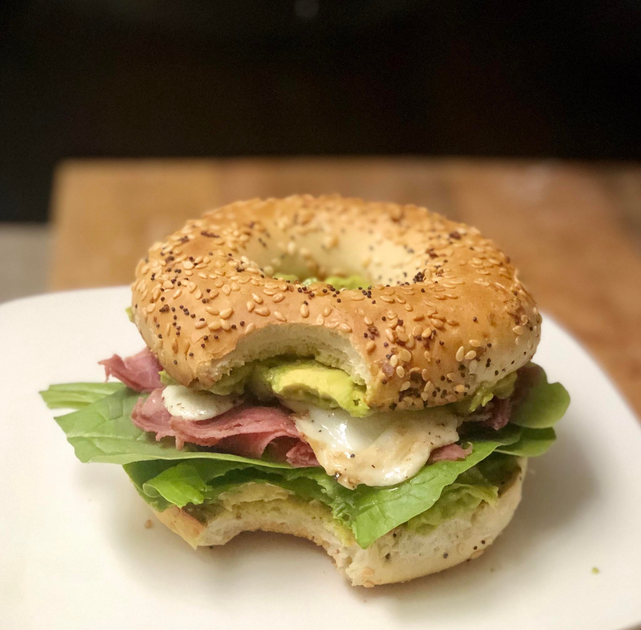 Everything bagel, guac on both sides, corned beef, spinach and a fried