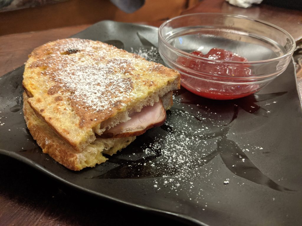 Monte Cristo sandwich on homemade sourdough with strawberry jam