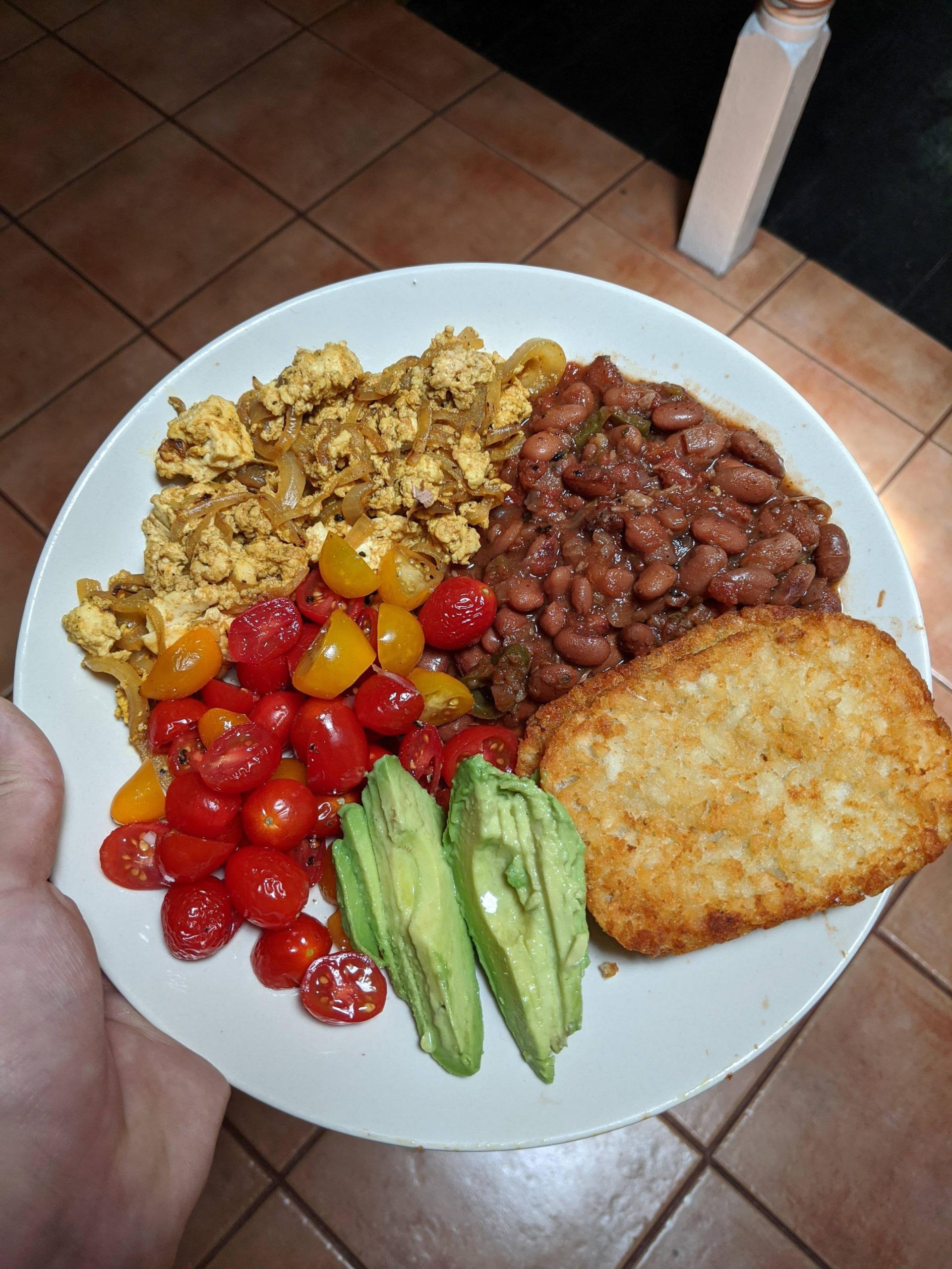 Tofu scramble + pinto beans with avocado, tomatoes and hashbrowns