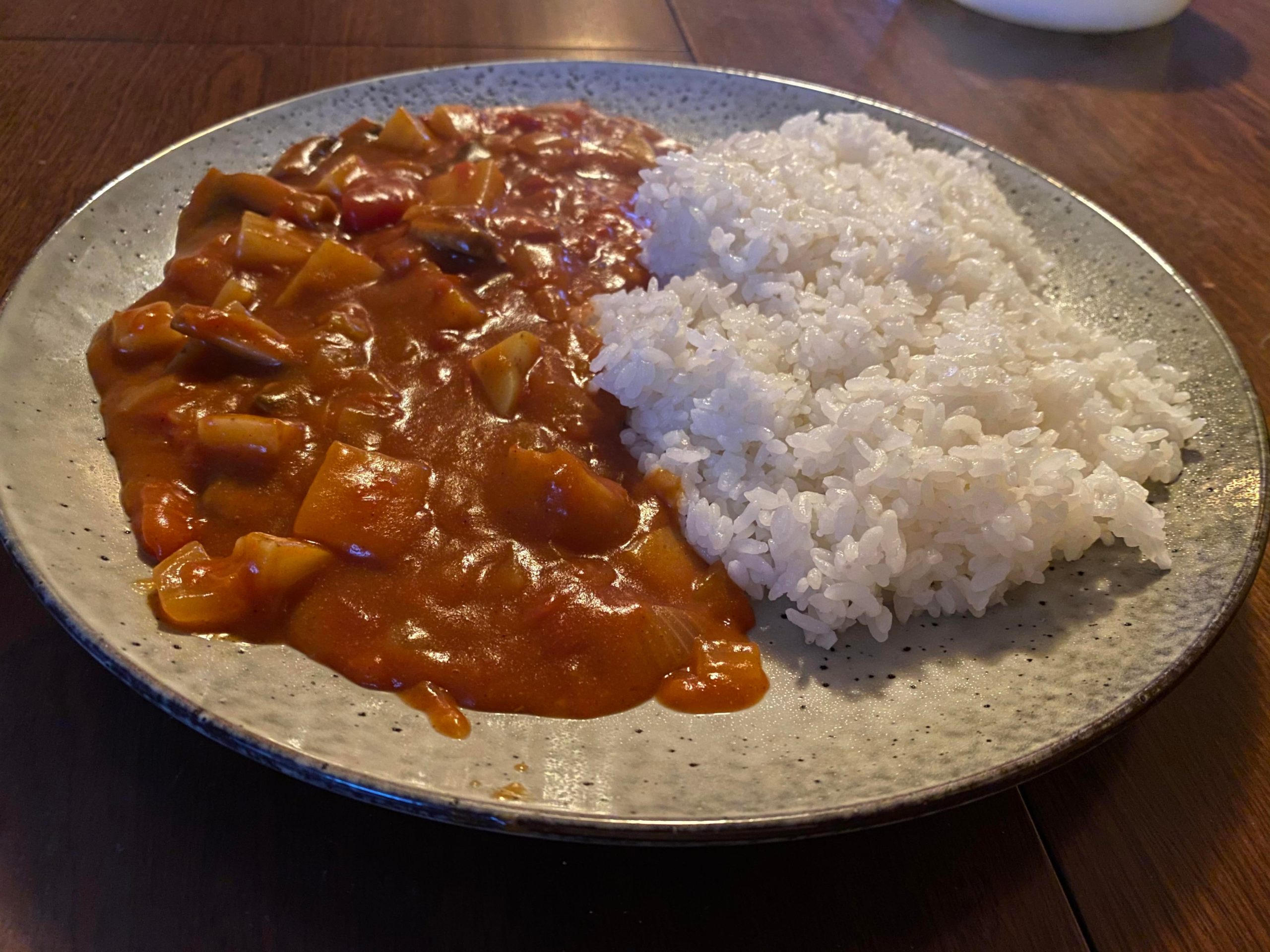 Tomato Japanese curry with Japanese rice. Dining and Cooking