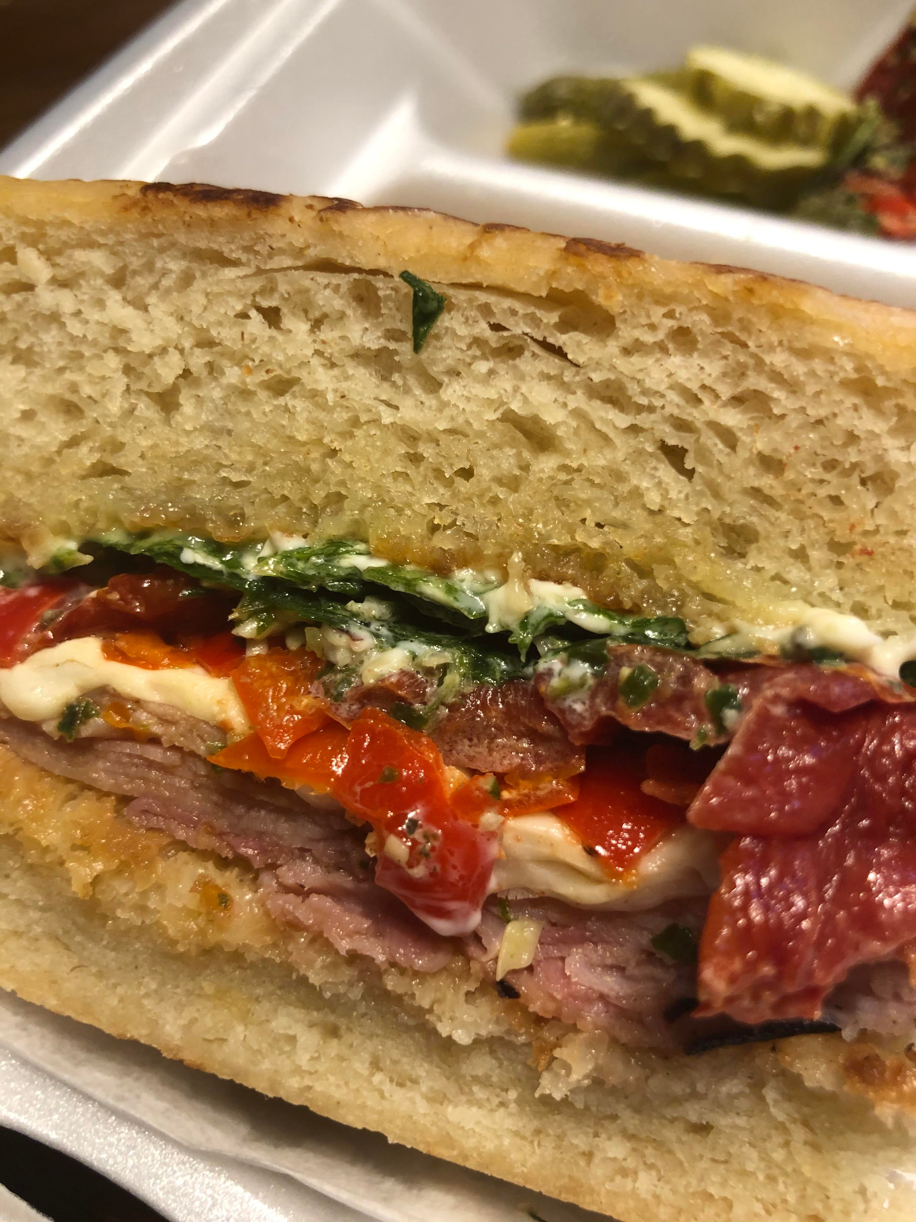The Italian Ham grilled sourdough, honey ham, roasted tomatoes, arugula, pesto, Calabrian