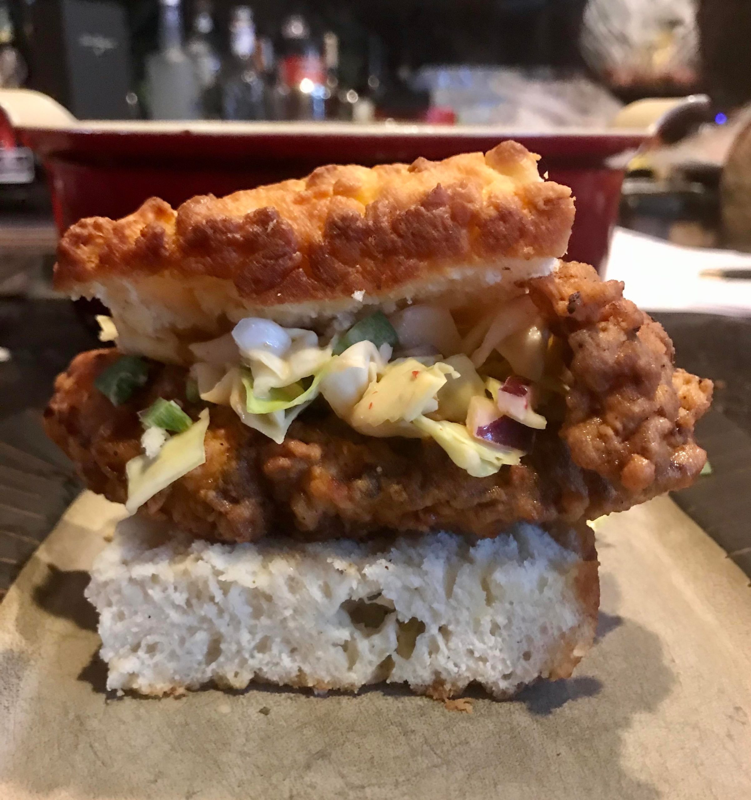 Fried chicken in a buttermilk biscuit with spicy slaw and chipotle