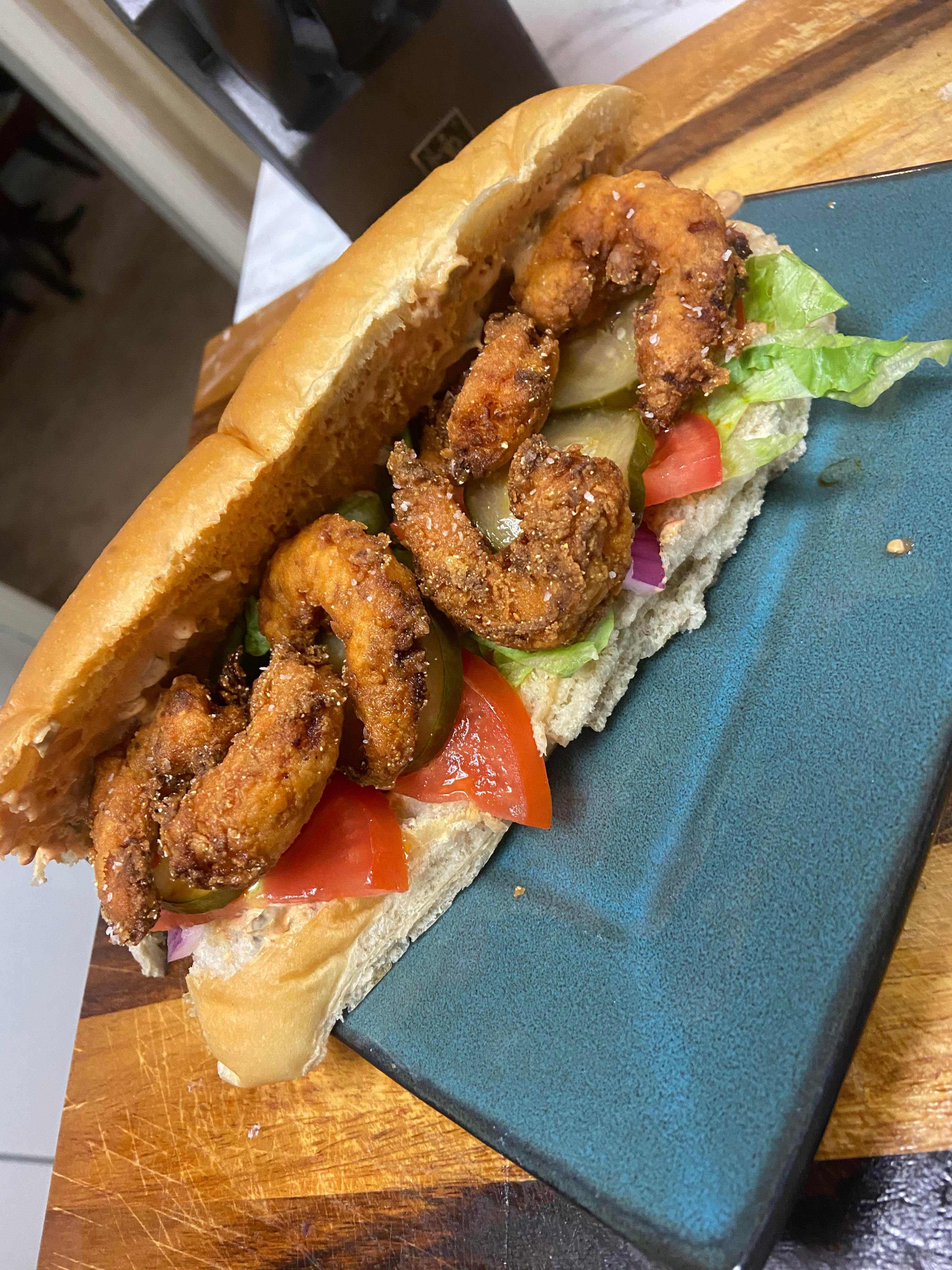 Shrimp Po Boy with remoulade and home made spicy pickles Dining and