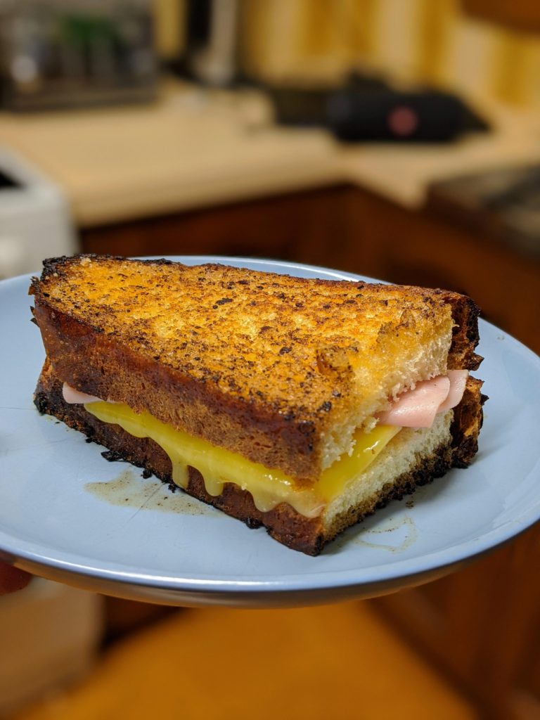 Ham and Cheese Toastie I made in a pan that had just cooked up some steak