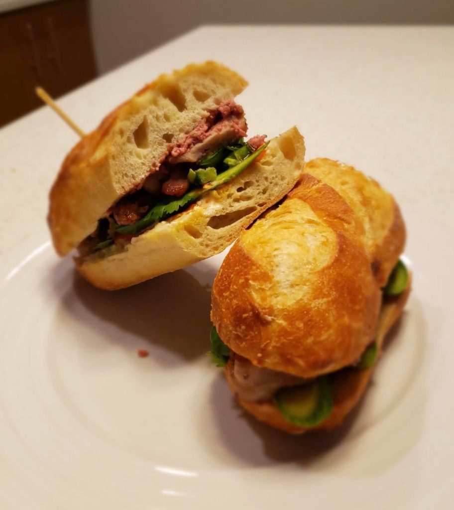 Homemade Banh Mi with roasted pork, pork pâté, pickled carrots and extra cilantro!