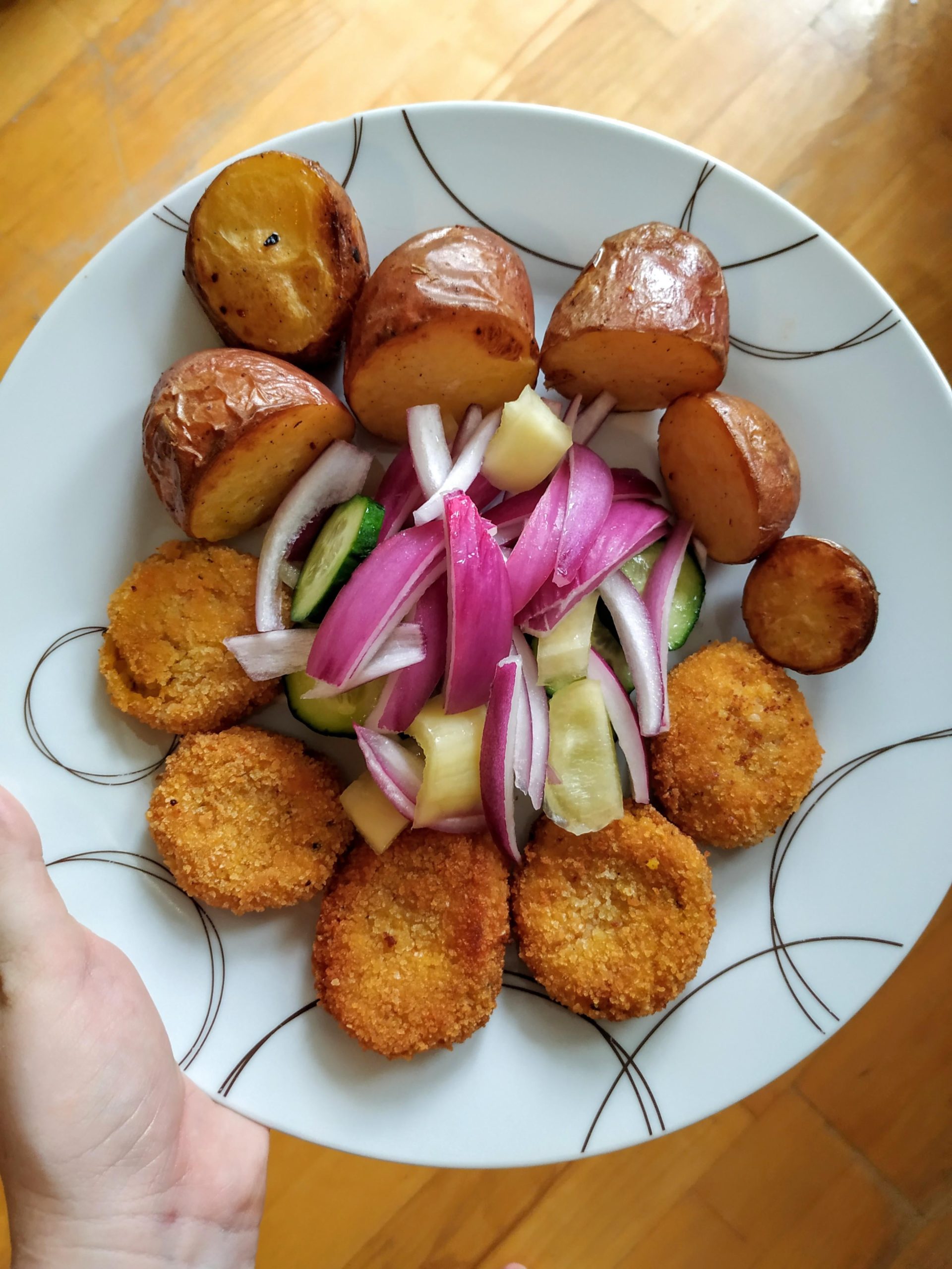 Veggie nuggets with oven baked potato and some fresh veggies. Dining