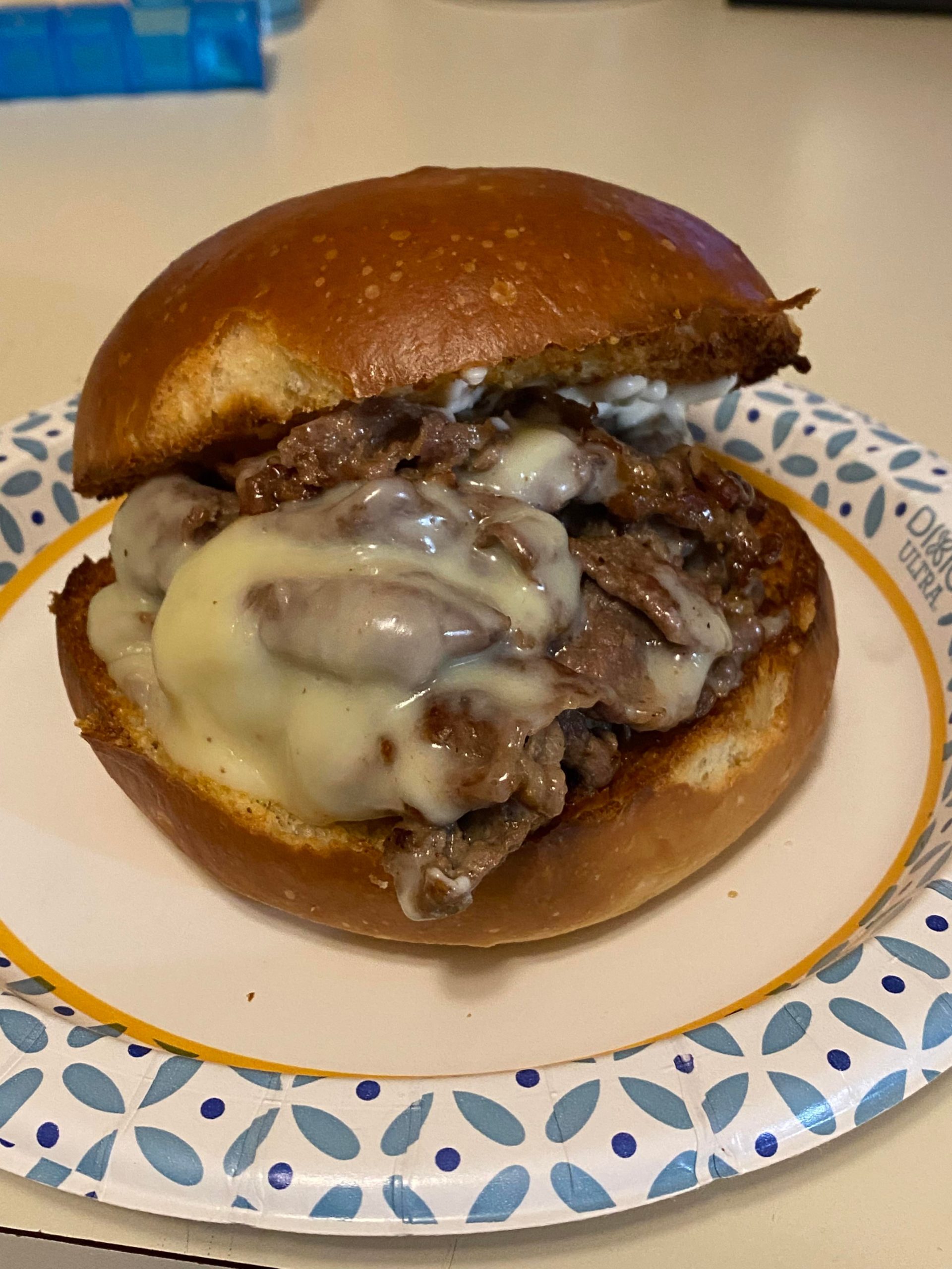 Steak and cheese on a garlic bread brioche bun Dining and Cooking