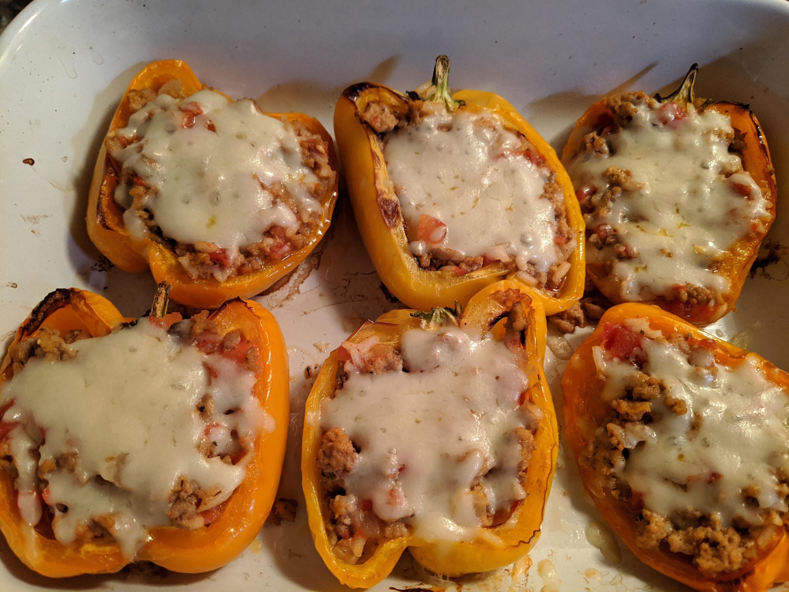 Stuffed peppers with ground turkey, rice, diced tomatoes, onion, mozzarella and Italian
