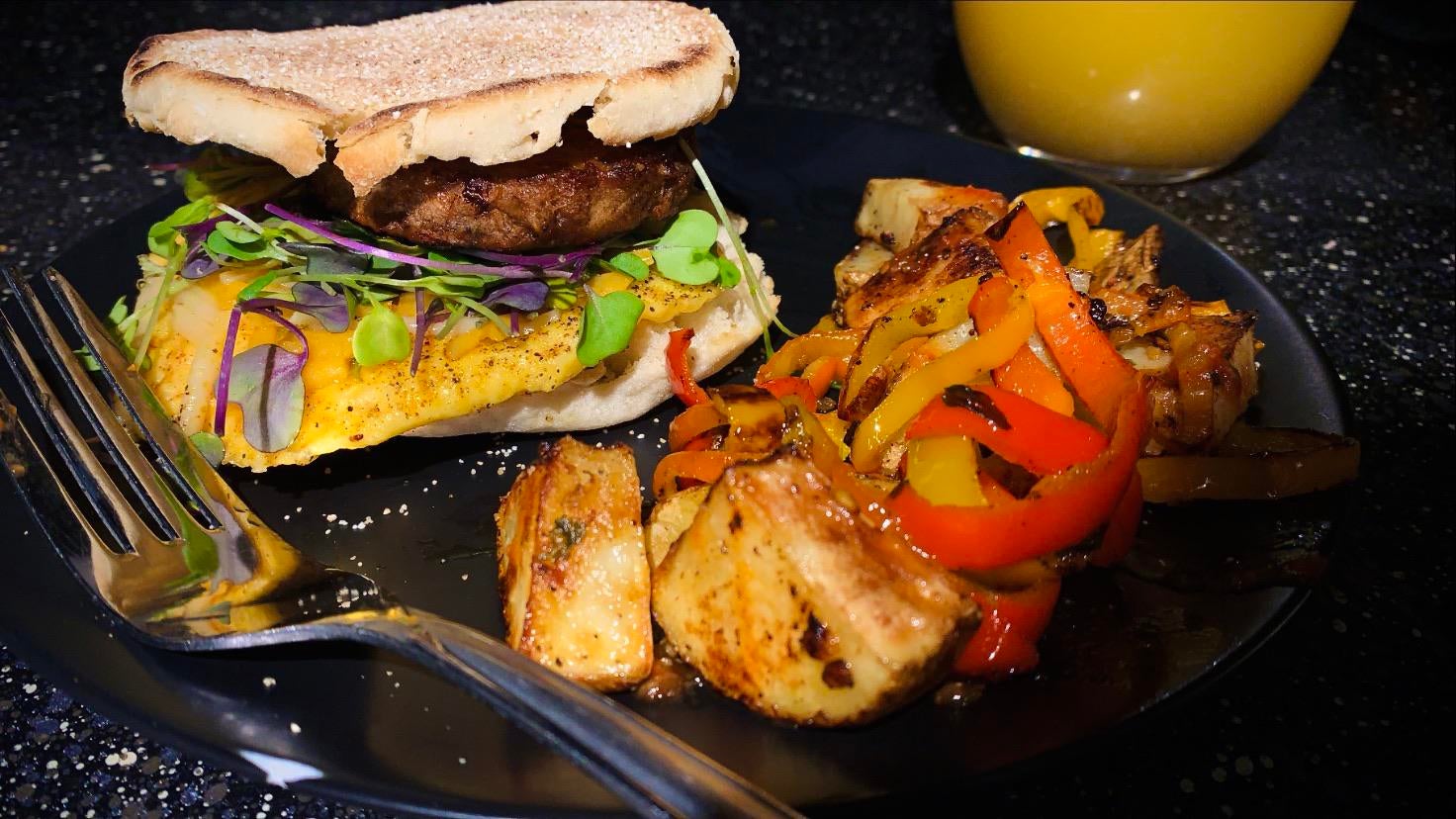 Sausage & egg breakfast sandwich with potatoes O’Brien! Dining and