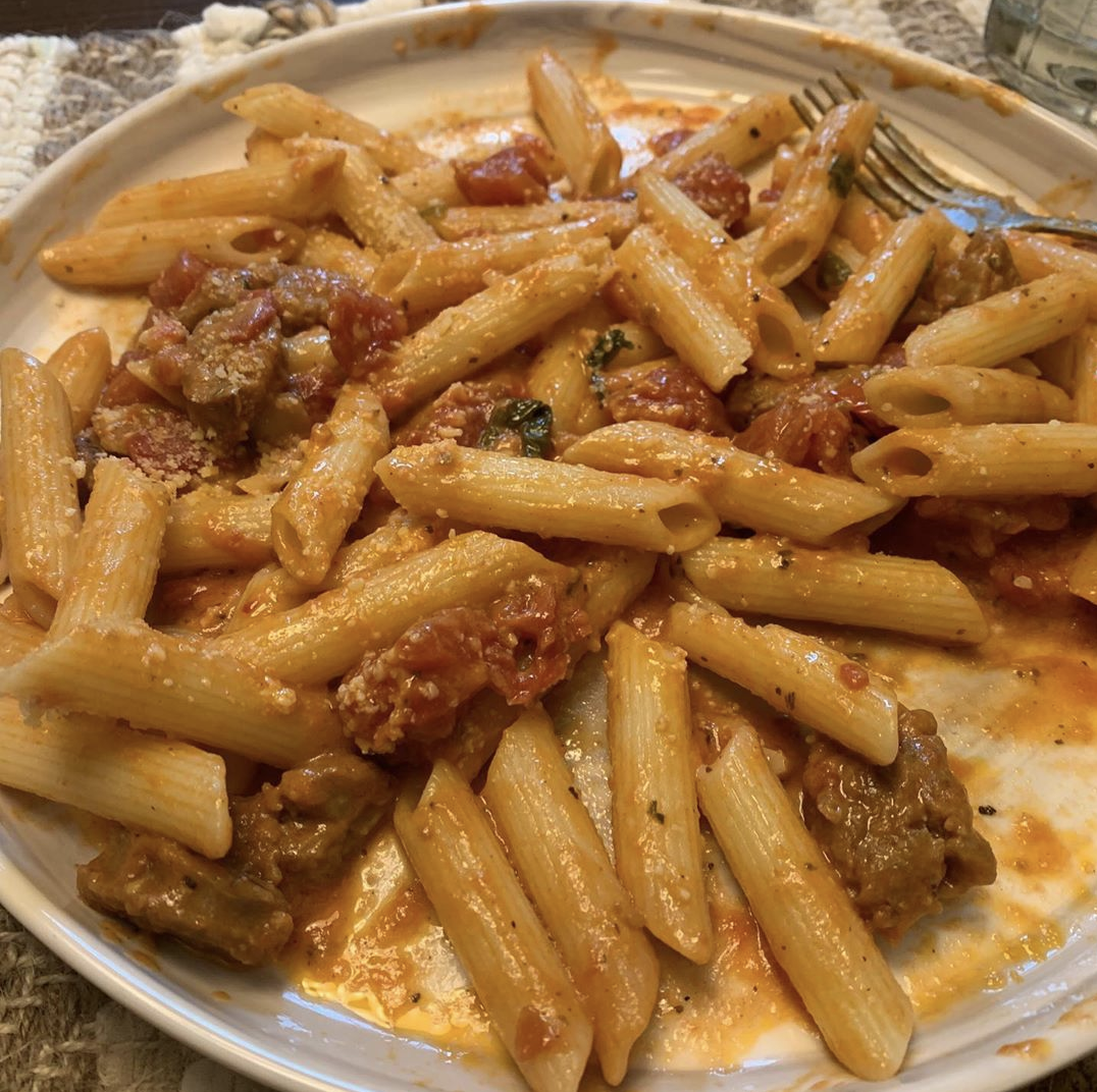 Homemade vodka sauce with spicy Italian sausage and fresh herbs from my