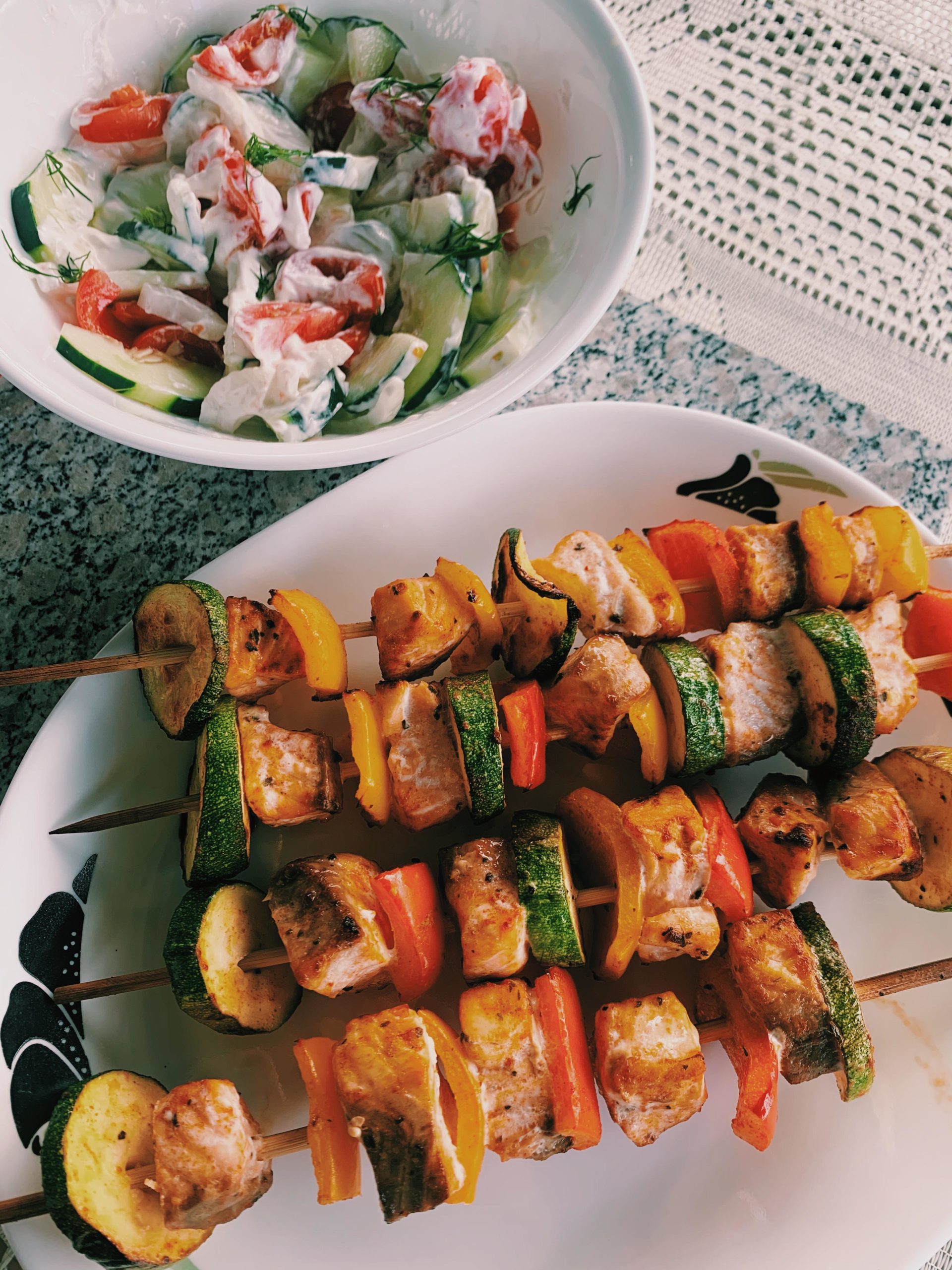 Salmon Skewers with bell pepper and zucchini and a tomato cucumber
