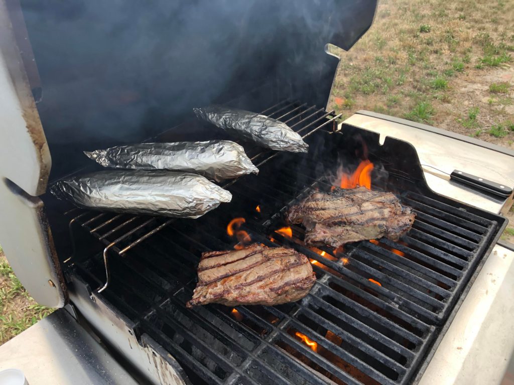 Ribeye on the weber grill with corn on the cob