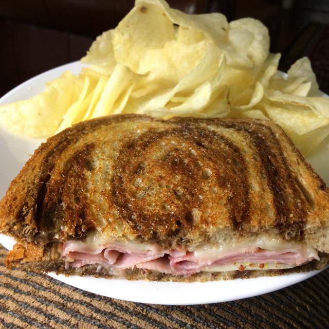 Half of a grilled ham and swiss on rye Dining and Cooking