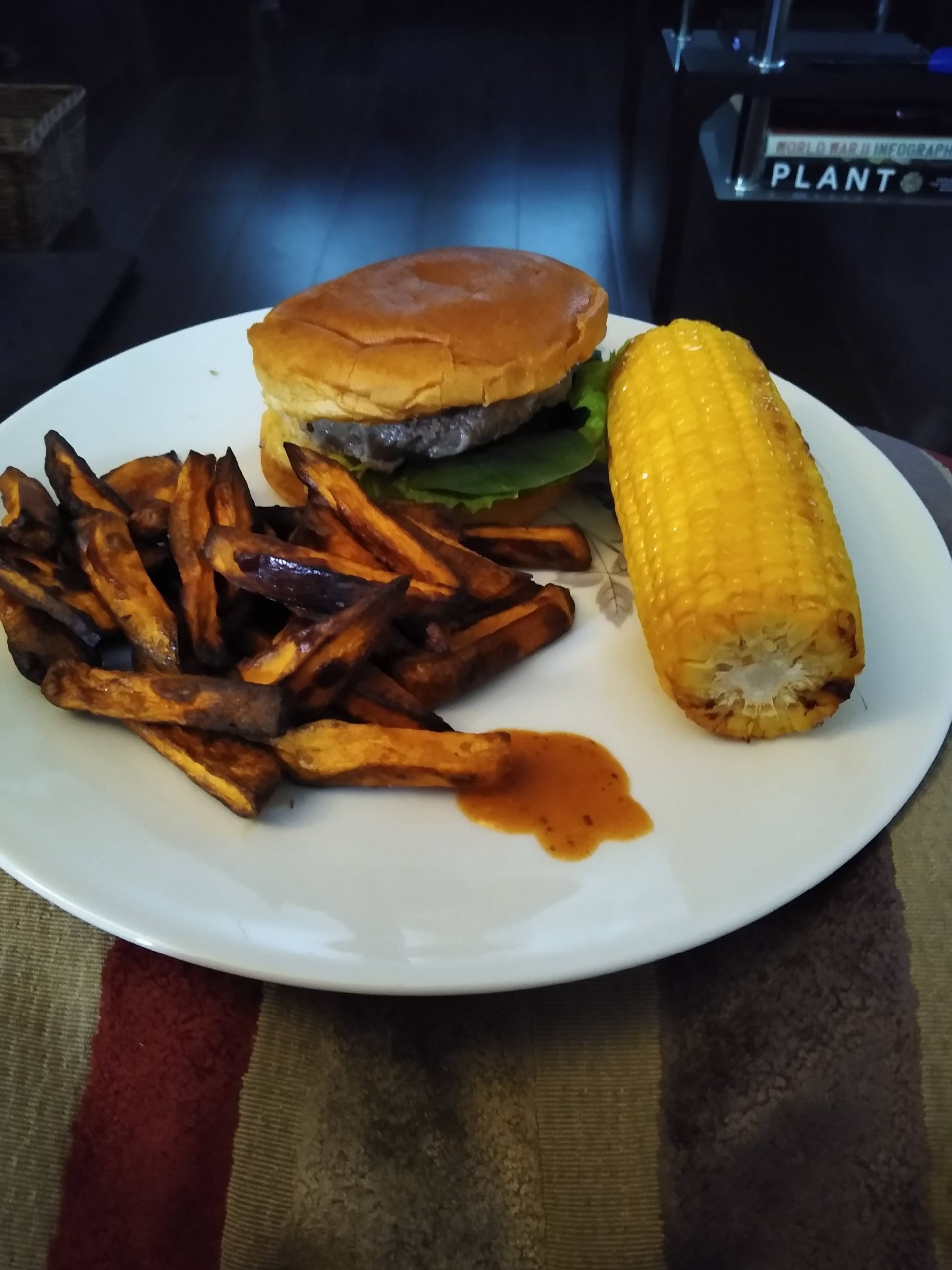 Cheeseburger with a pile of sweet potato fries for dinner. About 650 calories! Dining and Cooking
