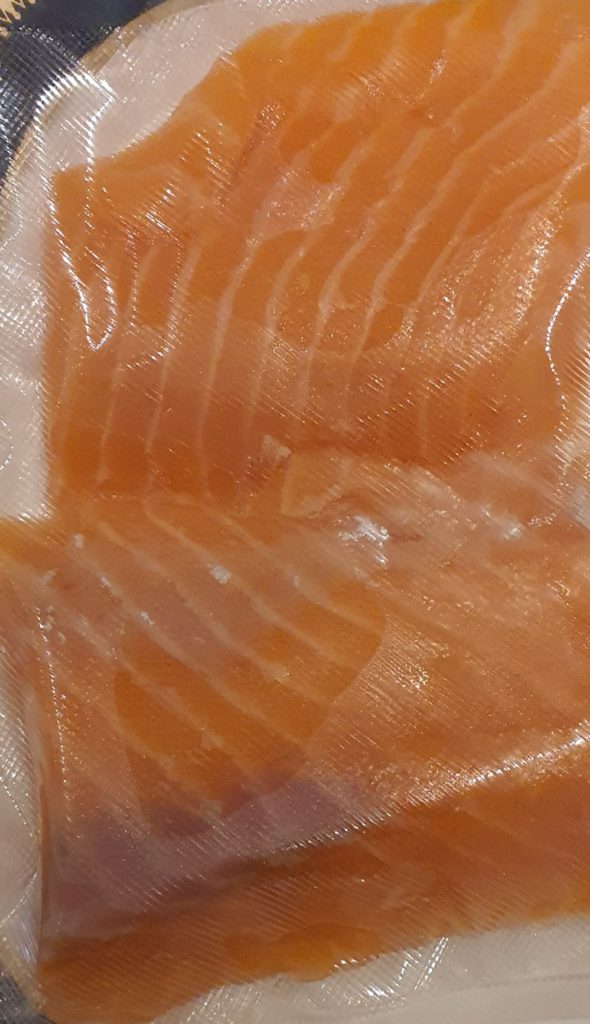 Salmon developed greyish brown spots..is it safe
